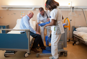 Doctors helping a patient